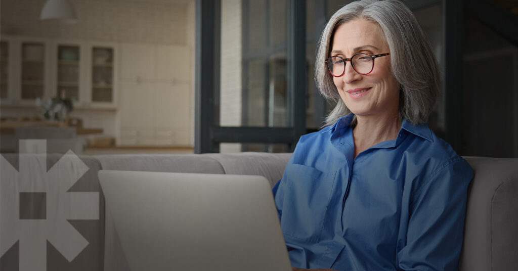 A woman on her laptop enjoys simplified access to helpful scheduling and information on her preferred hospital’s website.